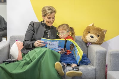The Countess of Wessex celebrates World Book Day with a young reader with vision impairment. PA