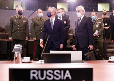 Russian Deputy Foreign Minister Alexander Grushko, right and Mr Stoltenberg attend the summit in Brussels. EPA 