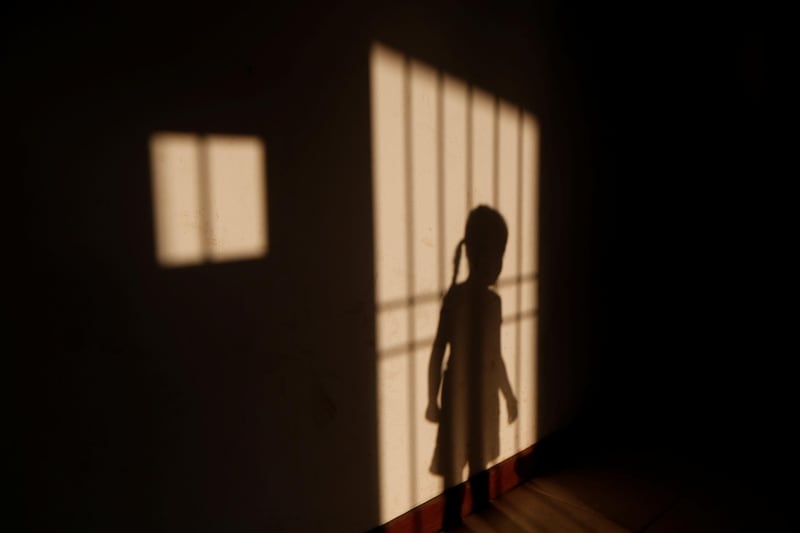 The niece of Maroly Bastardo, an eight months pregnant woman who disappeared in the Caribbean Sea after boarding a smuggler's boat during an attempt to cross from Venezuela to Trinidad and Tobago, casts her shadow at her relatives' home in El Tigre, Venezuela. Reuters