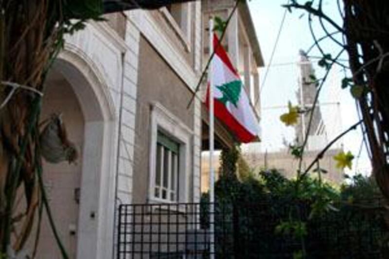 A Lebanese flag is seen in front of the Lebanon embassy building in Damascus, near the U.S embassy (back), March 16, 2009.  A Lebanese embassy opened in Damascus on Monday after international pressure on the Syrian government to establish diplomatic ties and treat its smaller neighbour as a fully sovereign country. The two countries have not had diplomatic relations since Britain and France carved them out of the remnants of the old Ottoman Empire in 1920.  REUTERS/Khaled al-Hariri (SYRIA POLITICS) *** Local Caption ***  SYR04_SYRIA-LEBANON_0316_11.JPG
