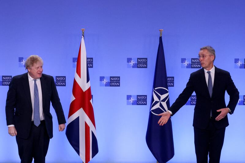 Boris Johnson is welcomed by Jens Stoltenberg at Nato headquarters. Reuters