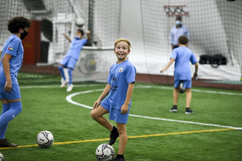 Manchester City Football-AD  Young kids from the Manchester City Football club excited to take part for the Champions League next weekend at the OfficerÕs Club Indoor Club on May 23, 2021. Khushnum Bhandari / The National 
Reporter: Gillian Duncan News
