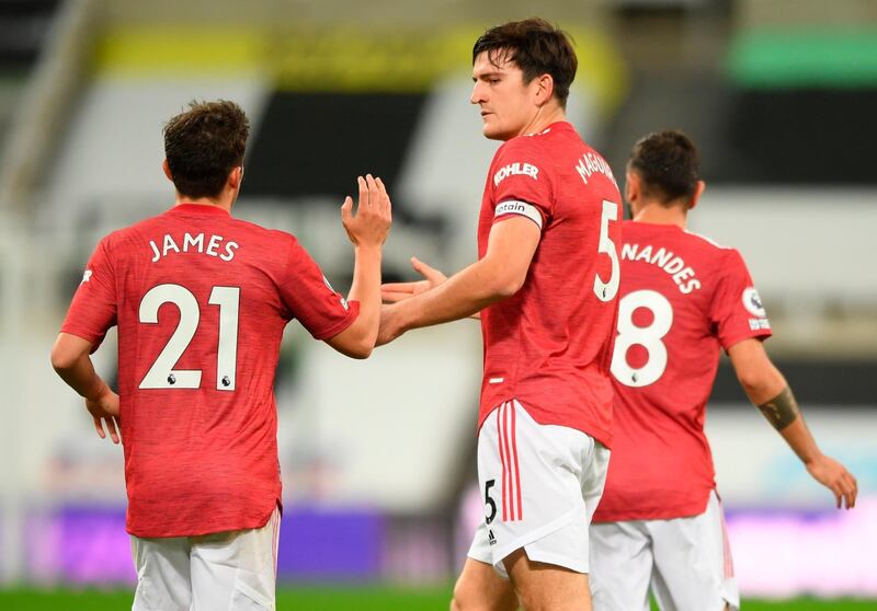 Manchester United's Harry Maguire celebrates with teammate Daniel James after levelling the match against Newcastle. EPA