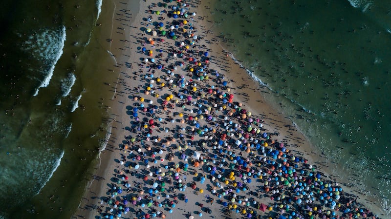 People enjoying the beach during a heatwave in Rio de Janeiro on March 17. AFP