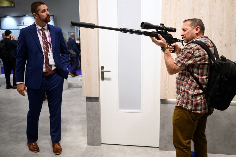A visitor with a Sig Sauer Cross rifle. Getty Images