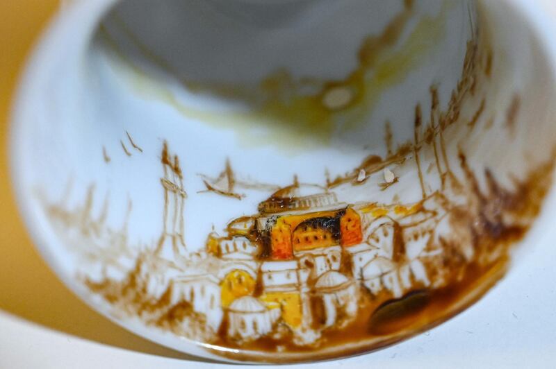 A painted Turkish coffee cup by Turkey's micro artist Hasan Kale in Istanbul.