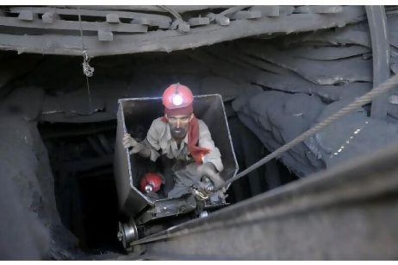 A miner emerge from a tunnel during the rescue operation at the coal mine in Sorange district, Baluchistan yesterday.