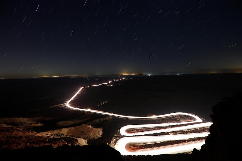 Cars drive through Ramon Crater during the Perseid meteor shower near the town of Mitzpe Ramon, southern Israel. Reuters