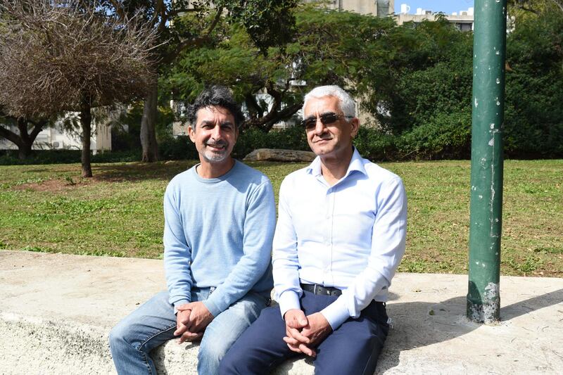 Moshe Shitrit (L) sits beside his brother Itzhak Shitrit in a park in Tel Aviv. Rosie Scammell for the National