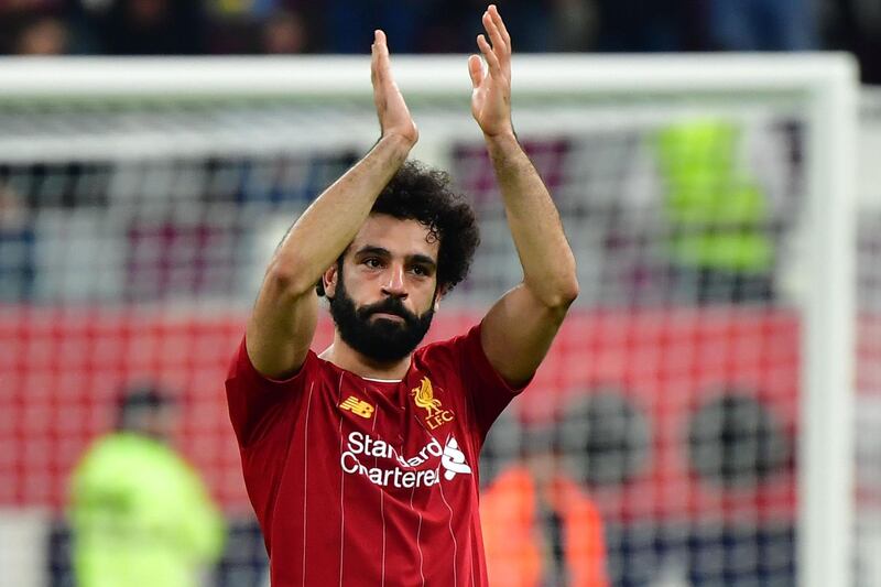 Liverpool's Egyptian midfielder Mohamed Salah greets the fans following the FIFA Club World Cup semi-final win over Monterrey. AFP