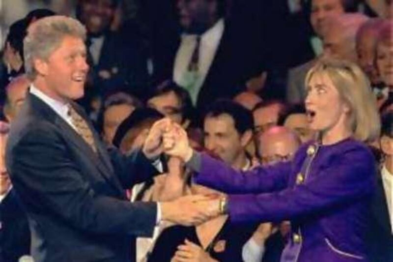 ** FILE ** ** ADVANCE FOR THURSDAY, MAY 29 **  In this file photo from Nov. 1, 1992, former President Bill Clinton and current Democratic presidential hopeful, Sen. Hillary Rodham Clinton, D-N.Y., dance on stage during a "Get-Out-The-Vote" rally at the Brendan Byrne Arena in East Rutherford, N.J. Sunday night, Nov. 1, 1992. (AP Photo/Susan Ragan, File)