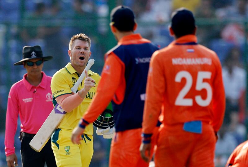 Australia's David Warner reacts while talking to the Netherlands players after the third umpire ruled him not out from a catch. Reuters