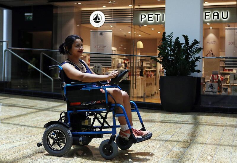 Dubai, United Arab Emirates- July, 13, 2016 :  Shobhika Kalra, Co- Founder, Wings of Angelz, who is wheelchair bound due to a degenerative disorder called Fredreichs Ataxia pose during the interview at the Mall of Emirates in Dubai  . ( Satish Kumar / The National  )
ID No: 71007
Section: News
Reporter: Jennifer Bell *** Local Caption ***  SK-ShobhikaKalra-13072016-03.jpg