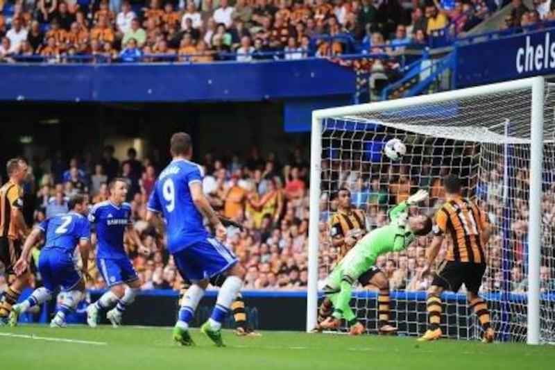 Hull goalkeeper Allan McGregor saves Branislav Ivanovic's header at the second attempt as Hawk-Eye was used for the first time in the Premier League yesterday at Stamford Bridge. The goal-line technology showed the whole of the ball did not cross the line. Richard Heathcote / Getty Images