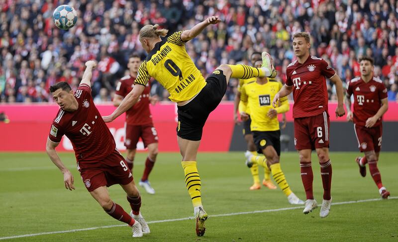 Lewandowski in action with Dortmund's Erling Haaland. EPA