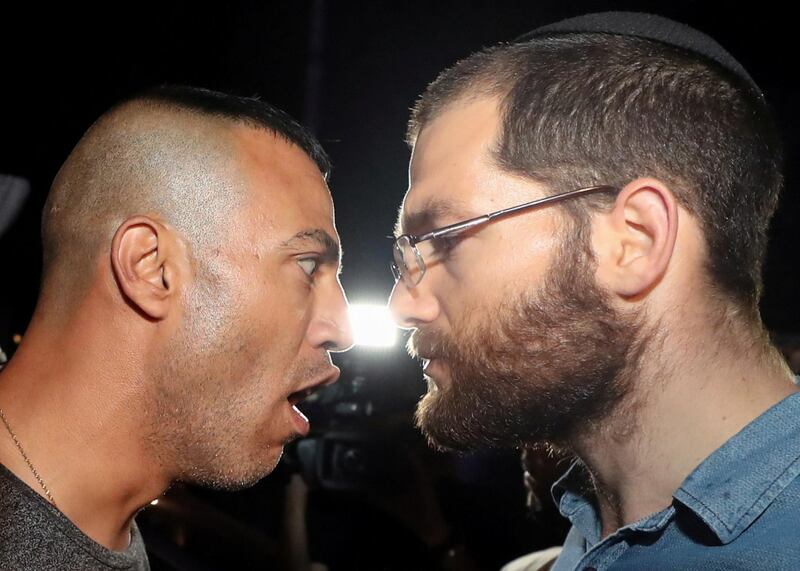 A Palestinian protester confronts a Jewish settler amid ongoing tension ahead of an upcoming court hearing in an Israel-Palestinian land-ownership dispute in the Sheikh Jarrah neighbourhood of East Jerusalem. Reuters