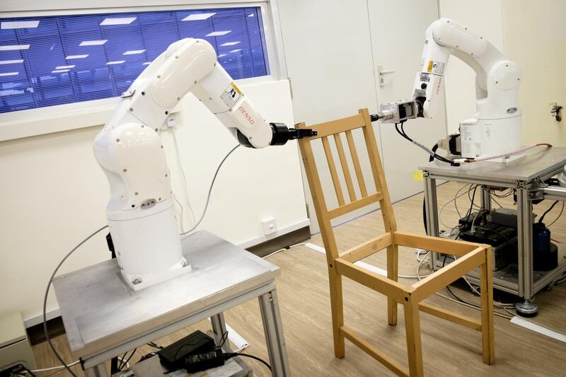 Robots assemble an Ikea chair at Nanyang Technological University (NTU) in Singapore April 17, 2018. Picture taken April 17, 2018. NTU/Handout via REUTERS. ATTENTION EDITORS - THIS IMAGE WAS PROVIDED BY A THIRD PARTY. NO RESALES. NO ARCHIVES.