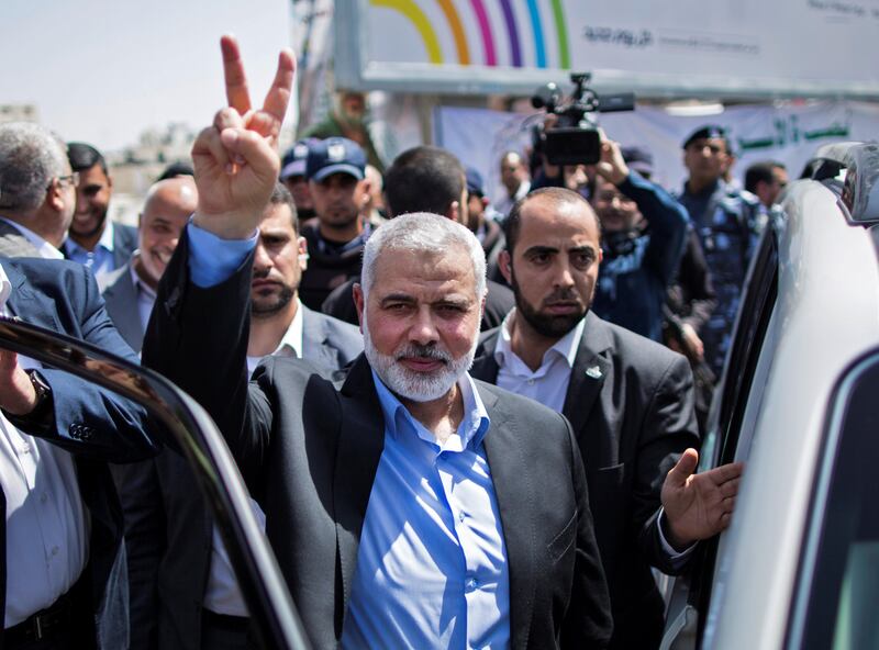 Newly elected Hamas chief, Ismail Haniya, flashes the V-sign after visiting protesters taking part in a sit-in in support of Palestinian hunger-striking prisoners held in Israeli jails, on May 8, 2017, in Gaza City. / AFP PHOTO / Mahmud Hams
