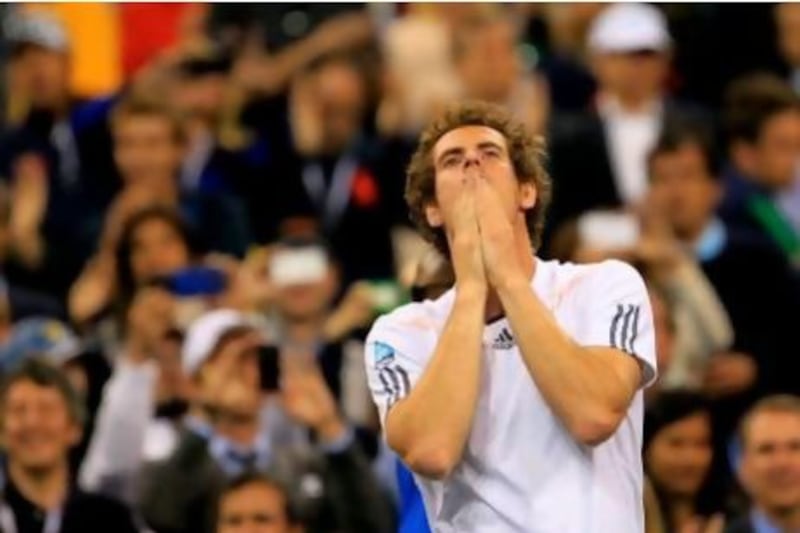 No dancing. No crying. Andy Murray celebrated his first grand slam title by putting his hands in front of his mouth, looking  up and crouching on the court. He later said he was a lot was going through his mind.