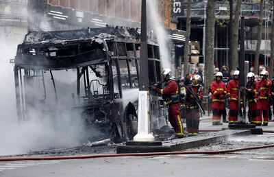 Firefighters work at the scene where the RATP electric bus caught fire. Reuters