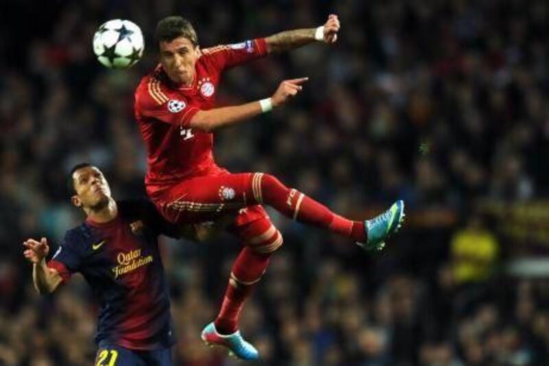 Bayern Munich (red kit) beat Barcelona in the other semi-final to set up an all-German clash at London's Wembley Stadium next weekend. Lluis Gene / AFP