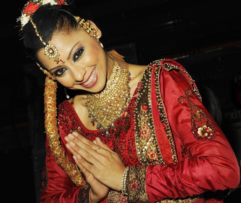 Carol Furtado, lead dancer, The Merchants of Bollywood, in full costume poses for the camera before going on stage.