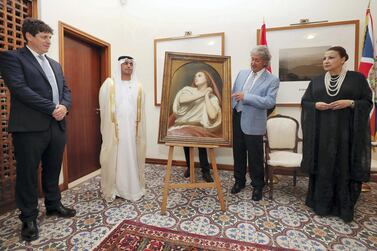 Ary Scheffer's masterpiece 'Mary Magdalene in Ecstasy' is presented to Dr Hamed Bin Mohamed Khalifa Al Suwaidi, Chairman of Abu Dhabi Arts Society, by Alan Lubin (right), President Emeritus of Five Islands Capital