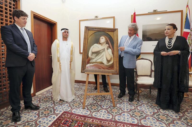 Abu Dhabi, United Arab Emirates - July 18, 2019: Presentation of the Masterpiece Mary Magdalene in Ecstasy, painted by Ary Scheffer, to Dr Hamed Bin Mohamed Khalifa Al Suwaidi, Chairman of Abu Dhabi Arts Society by Alan Lubin (R), President Emeritus of Five Islands Capital Limited of London, as a Loan in Perpetuity to the Emirate of Abu Dhabi, on behalf of the Lubin Family Art Collection Privé. Her Majesty's Ambassador from UK to UAE Patrick Moody (L) and Her Excellency Huda Kanoo, founder of Abu Dhabi Music and Arts Foundation. Thursday the 18th of July 2019. British Embassy, Abu Dhabi. Chris Whiteoak / The National