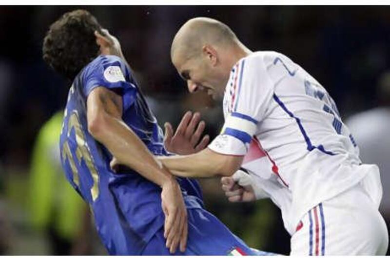 Zinedine Zidane, right, after head-butting Marco Materazzi in 2006.