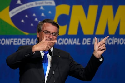 Brazilian President Jair Bolsonaro addresses the opening of the National Mayor's Meeting in Brasilia on Tuesday. AP Photo