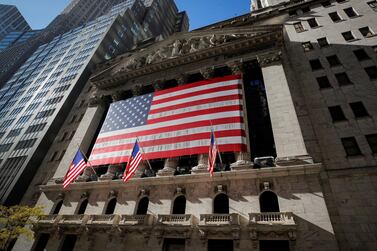 The US flag covers the facade of the New York Stock Exchange. The S&P 500 Index closed at two-month high on Monday. Reuters  