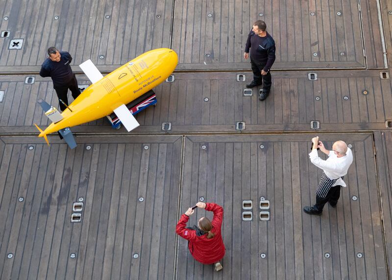 Visitors take photographs of Boaty McBoatface, a robotic submersible. EPA