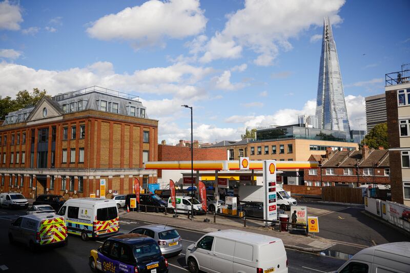 Vehicles queue for fuel at a petrol station in London. The UK was suffering from a shortage of lorry drivers, which has made it difficult for suppliers to deliver enough fuel to stations. Photo: Bloomberg