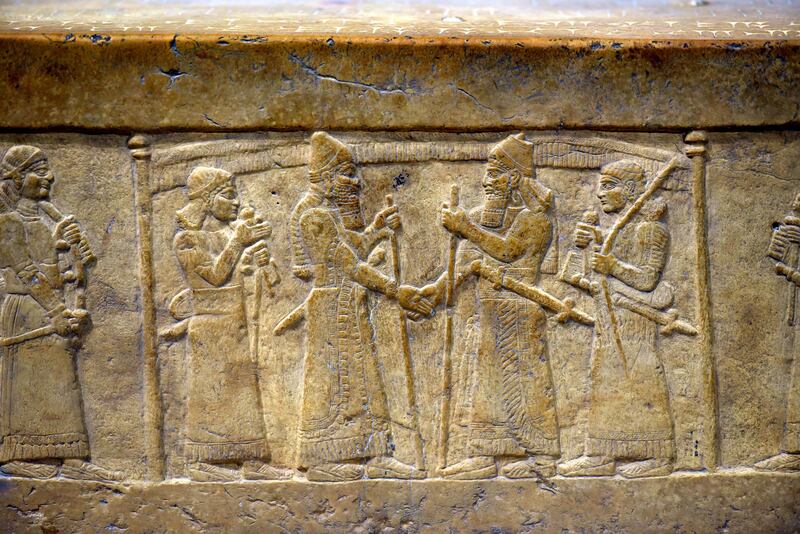 The 2,800-year-old stone relief held at The Iraq Museum in Baghdad. Assyrian King Shalmaneser III is seen shaking hands with Babylon’s King Marduk-zakir-shumi. Osama Shukir Muhammed Amin / Wikimedia Commons