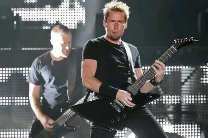 Nickelback will perform on Saturday as part of the F1 After Race Concerts in Abu Dhabi. The Canadian band are known for large-scale productions but say their UAE gig will be a more scaled-down show. AP Photo