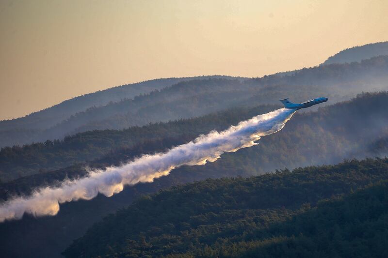 A plane drops water on a fire as it participates in a fire-extinguishing operation in southern Turkey. AP