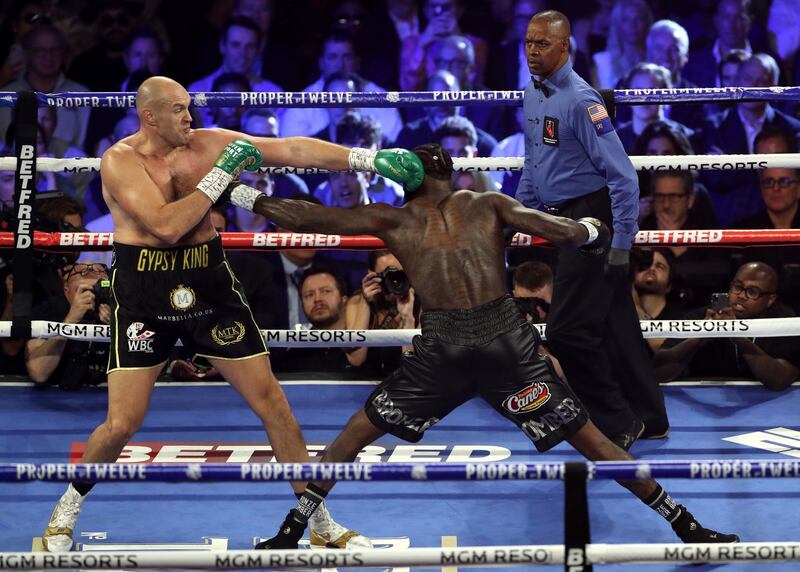 Tyson Fury and Deontay Wilder in the first round.