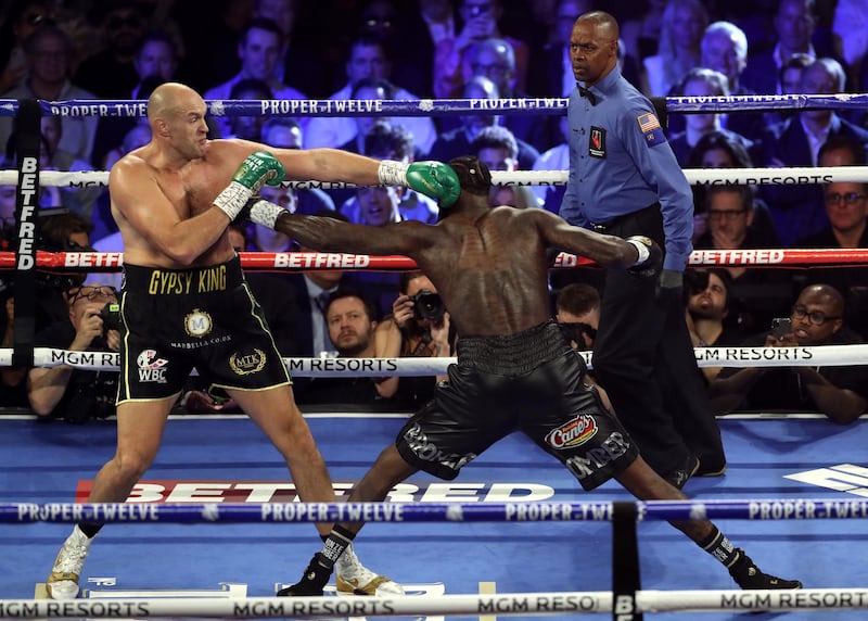 Tyson Fury and Deontay Wilder in the first round.