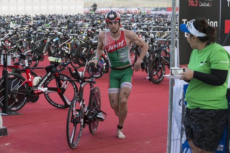 DUBAI, UNITED ARAB EMIRATES, 29 JANUARY 2016. The Ironman 70.3 Dubai Triathlon held on Sunset Beach next to the Burj Al Arab. Male constestants in the lead pack start the cycle leg of the race. (Photo: Antonie Robertson/The National) ID: None. Journalist: None. Section: Sport.