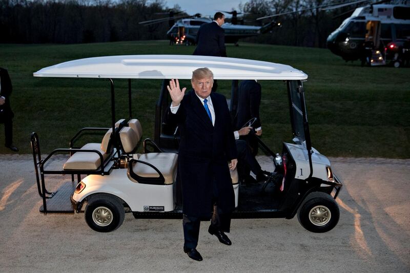 US President Donald Trump waves after stepping out of a golf cart following a dinner with French President Emmanuel Macron (not pictured) at the Mount Vernon estate of first US President George Washington in Mount Vernon, Virginia, USA, on April 23, 2018. President Macron will be in Washington DC for three days for a state visit at the White House and an address to a joint session of Congress on 25 April.  Andrew Harrer / EPA