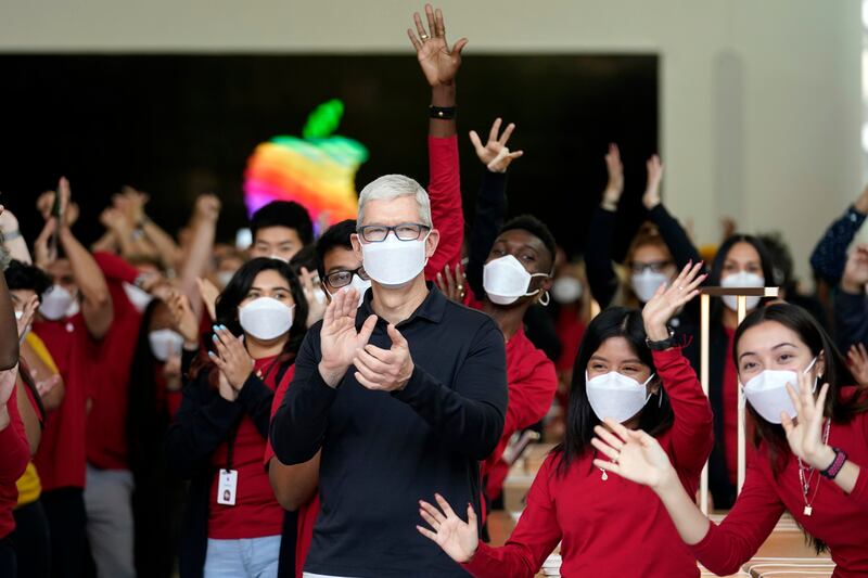 Apple chief executive Tim Cook welcomes customers during a visit to an Apple Store in Los Angeles in November. AP