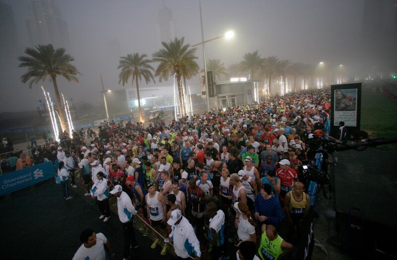 Dubai, United Arab Emirates, Jan 25 2013, 2013 Standard Chartered Dubai Marathon, - Thousands of Runners iline up before sunrise as they wait for the start of the Standard Chartered Dubai Marathon, Jan 25, 2013.  Mike Young / The National