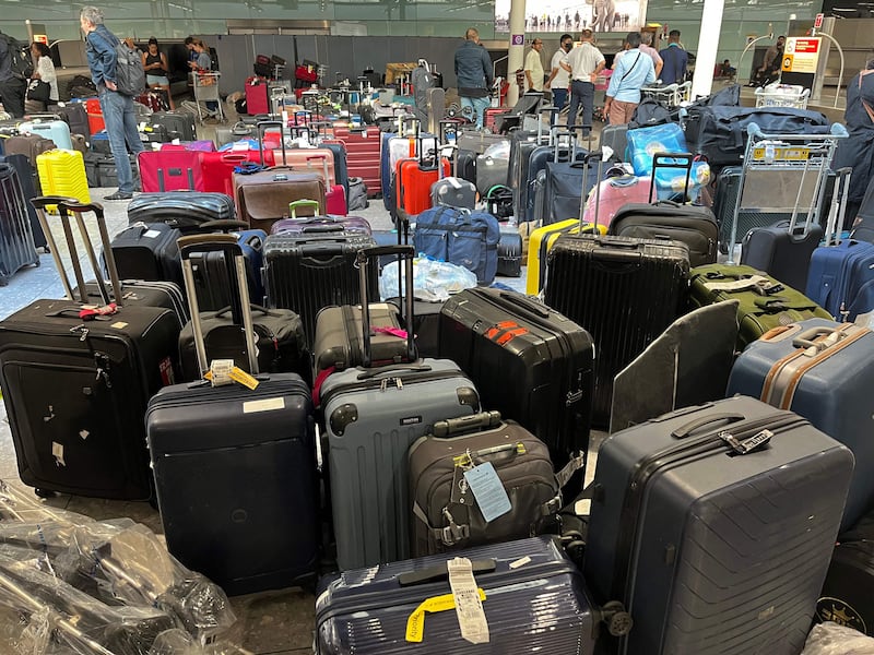 Uncollected suitcases pile up at Heathrow's Terminal Three baggage reclaim, as British Airways axed another 10,300 short-haul flights up to the end of October. AFP