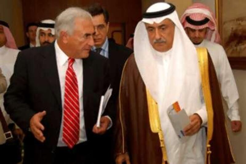 The director of the International Monetary Fund (IMF) Dominique Strauss-Kahn, walks with Saudi Finance Minister Ibrahim al Assaf following a meeting of the GCC finance ministers in Jeddah earlier this month.