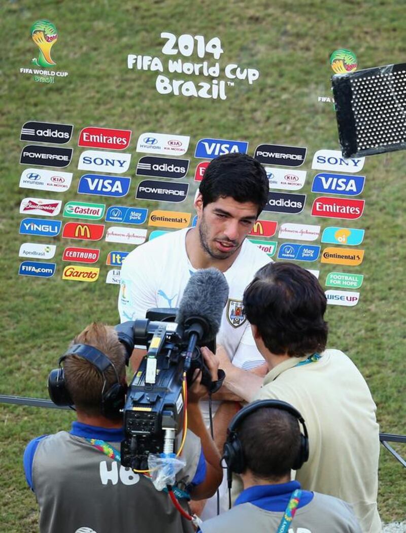 Luis Suarez of Uruguay is interviewed after the conclusion of their 1-0 win over Italy on Tuesday at the 2014 World Cup in Natal, Brazil. Julian Finney / Getty Images 