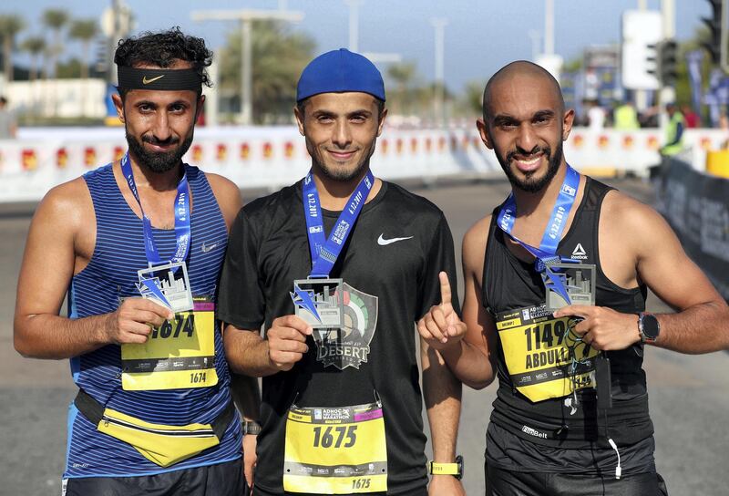 Abu Dhabi, United Arab Emirates - December 06, 2019: Athletes finish the ADNOC Abu Dhabi marathon 2019. Friday, December 6th, 2019. Abu Dhabi. Chris Whiteoak / The National