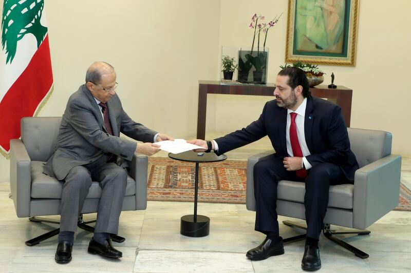 Mr. Hariri hands President Michel Aoun his government's resignation at the Baabda presidential palace. Dalati and Nohra / AFP