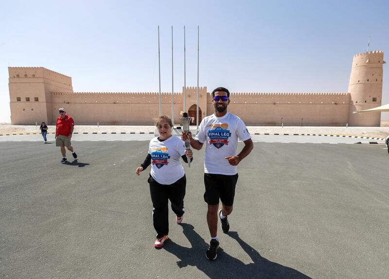 Abu Dhabi, United Arab Emirates, March 12, 2019.Special Olympics Torch Run Photo Opp at the Al Dhafrah Fort. --(L-R)  Chaica Al Qassimi and Yassir Al Zaabi during the torch run.
Victor Besa/The National
Reporter:  Shireena Al Nuwais
Section:  NA