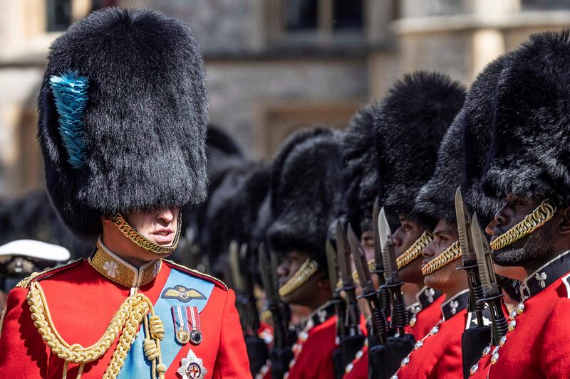 Britain's Prince William, Duke of Cambridge, inspects the 1st Battalion Irish Guards at Windsor Castle on Tuesday, before presenting the New Colours to the regiment. AFP