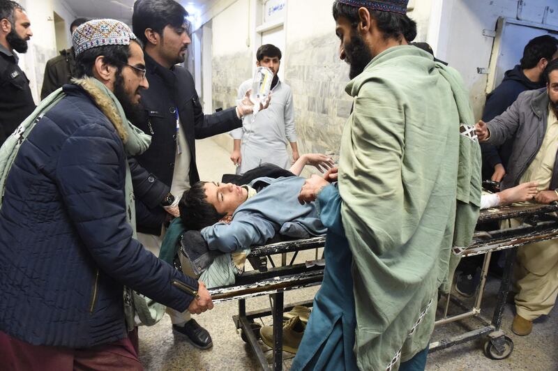 A victim of the blast is wheeled into a Quetta hospital on December 30. AFP